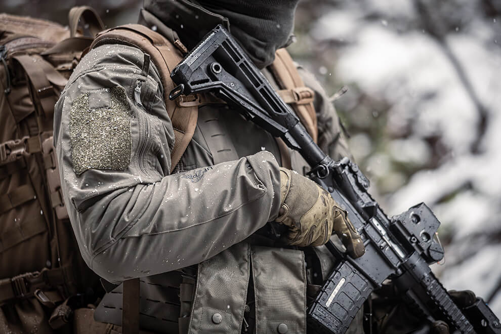 Closeup shot of a tactical operator in a snowy environment