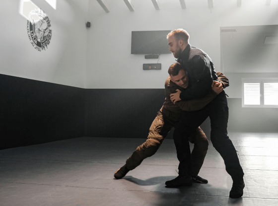 Front body lock position demonstration in Brazilian Jiu Jitsu.