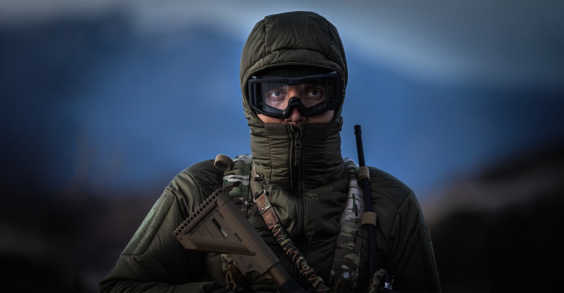 Portrait of an operator fully equipped in cold weather gear for a winter operation.