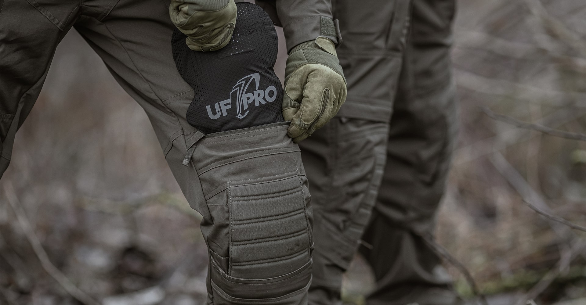 An operator demonstrating how to insert and remove knee pads.