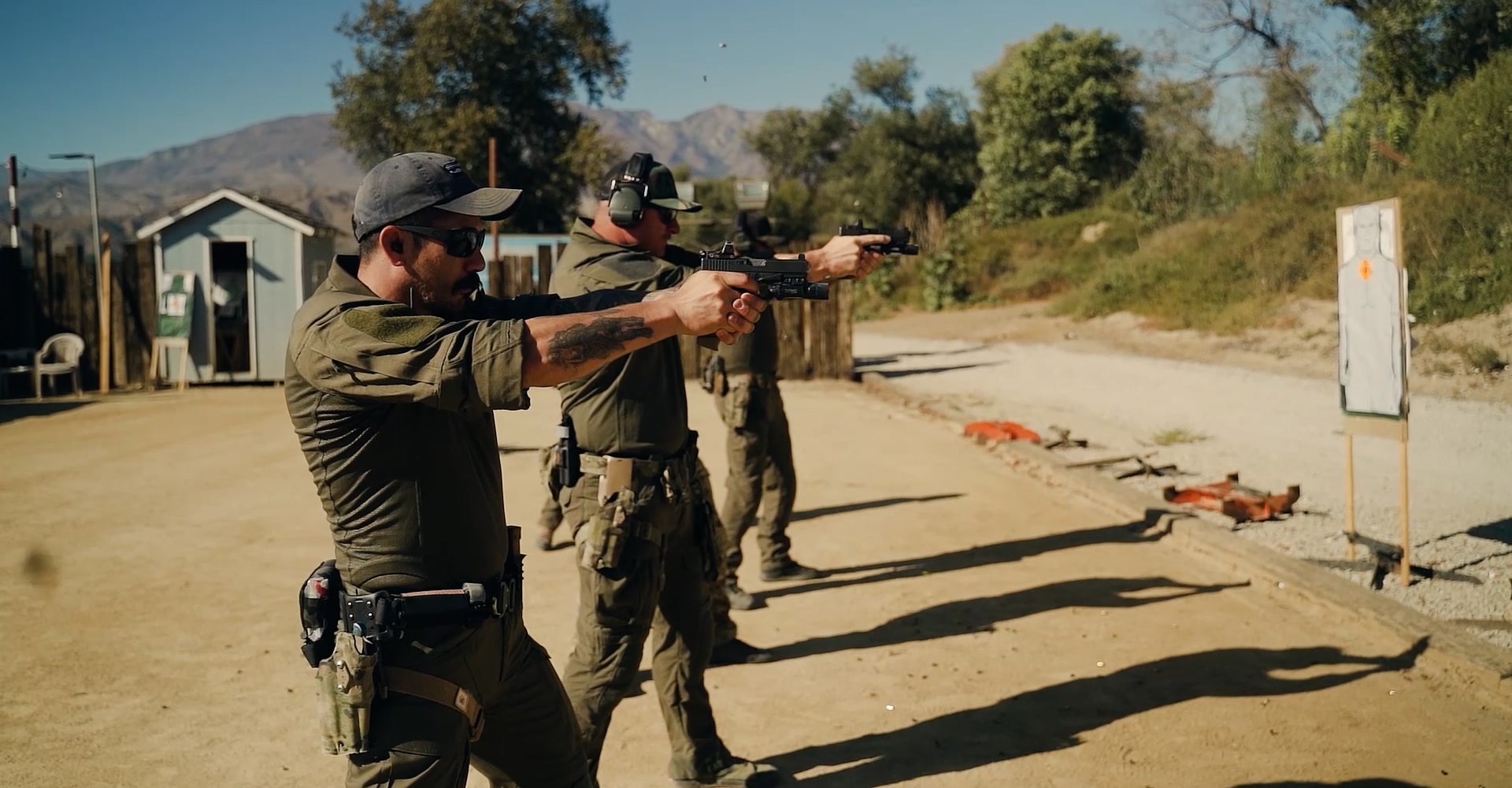 three operators seen traning with close combat shooting