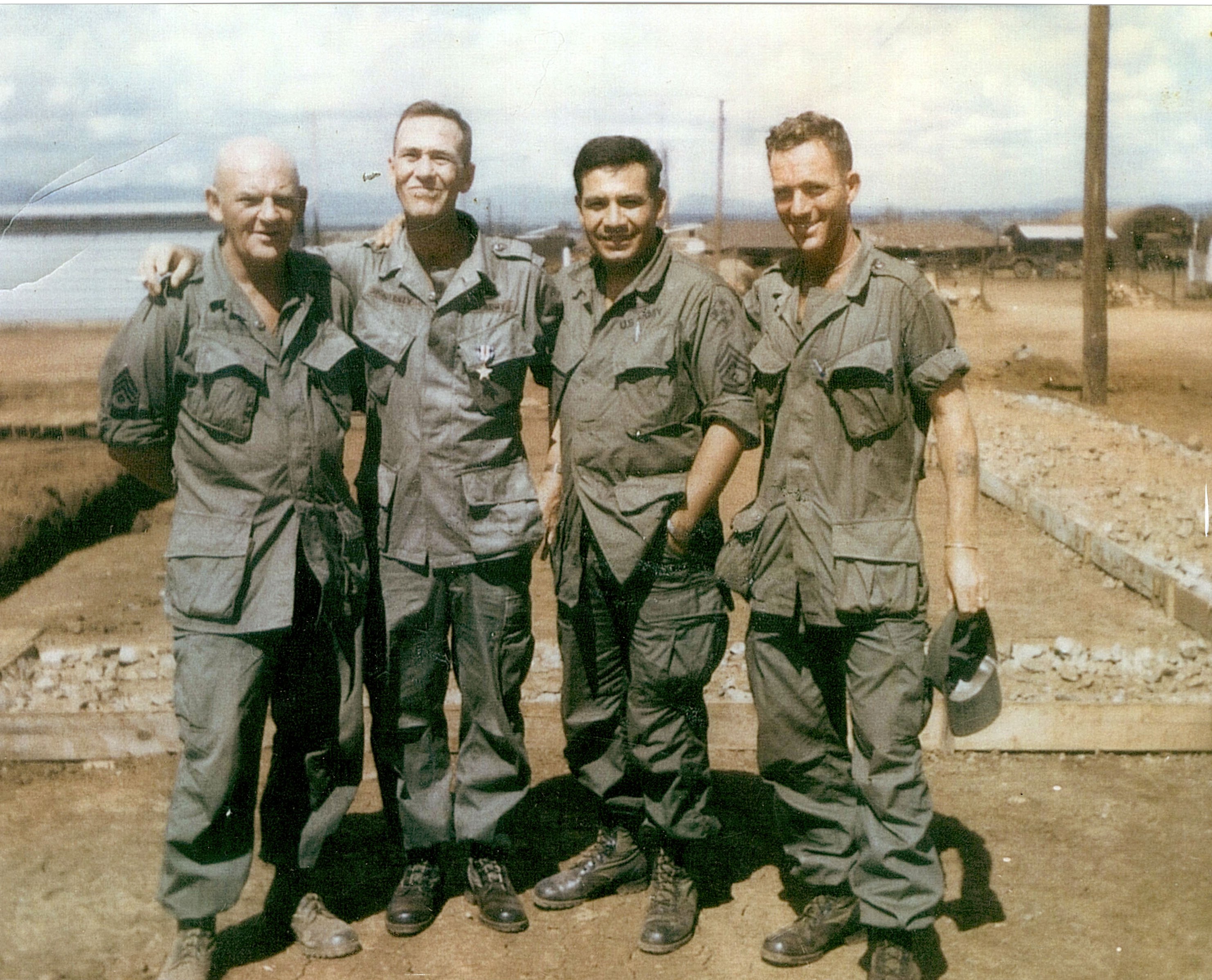 An old photo of a group of soldiers wearing the M-65 field jacket.