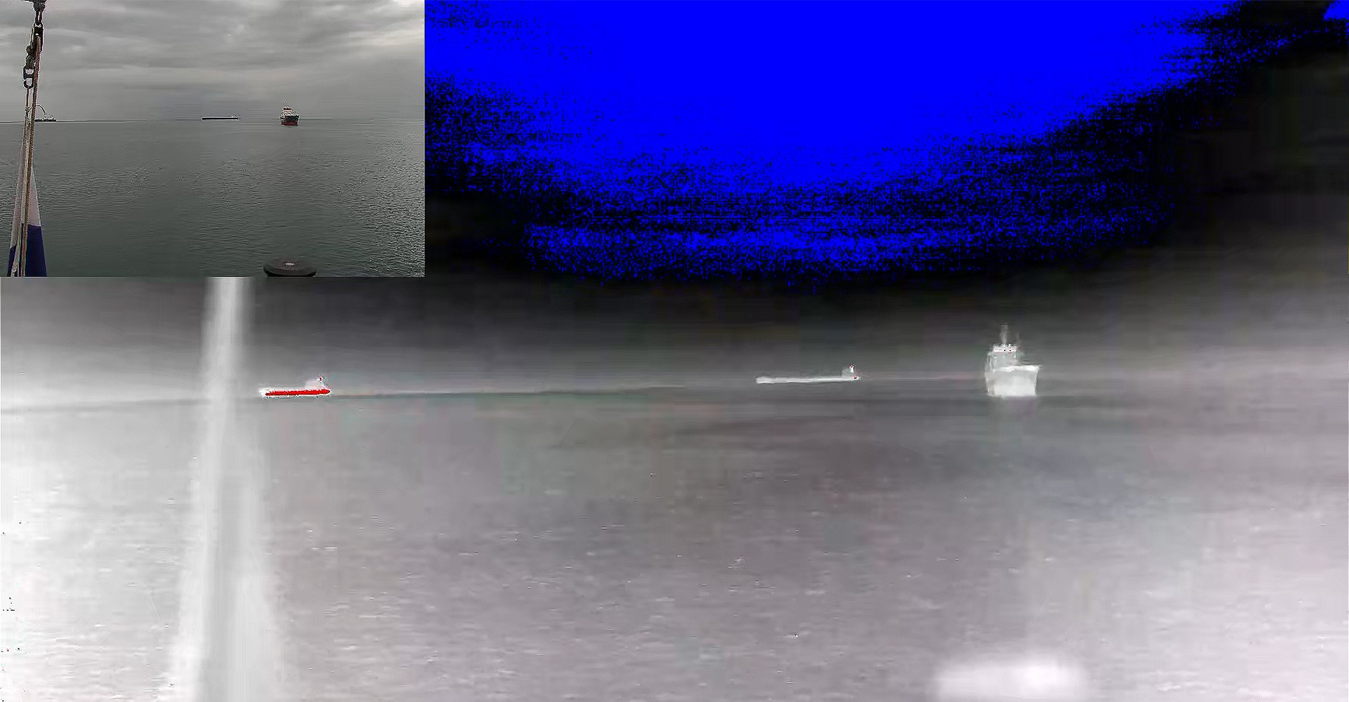 A thermal camera image capturing three ships on the distant sea, visible as heat signatures against the cool ocean backdrop.