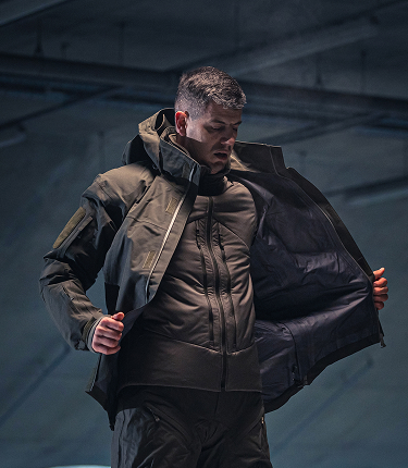 Person putting on Delta ML Gen.3 Tactical Winter Jacket.